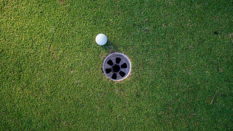 golf ball short of hole